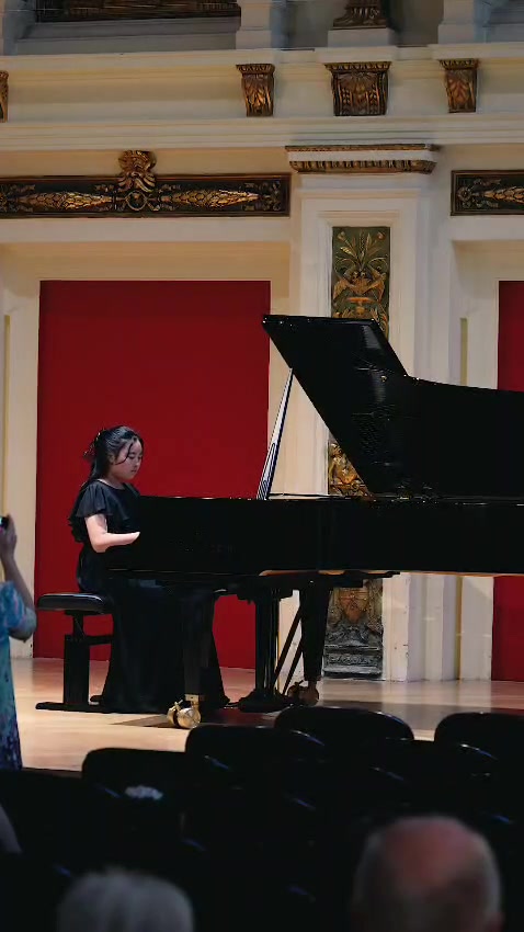A young pianist on stage at Ehrbar Saal